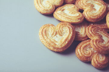 Homemade heart shaped sugar biscuit on gray background