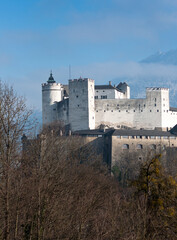 Fototapeta na wymiar Hohensalzburg Fortress sits atop the Festungsberg, a small hill in the Austrian city of Salzburg
