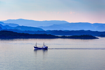 Fototapeta na wymiar Fishing boat at dawn