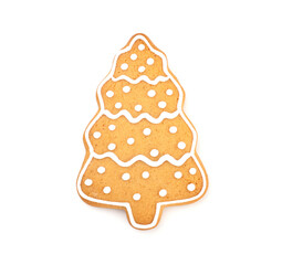 Christmas ginger and honey cookies form a Christmas tree covered with icing isolated on a white background