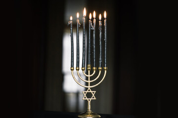 Menorah with dark candles, rituals and magical time