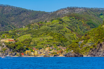A view from the sea of the Cinque Terre village of Monterosso in the summertime