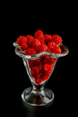raspberry on black background