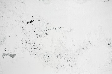 A ragged brick wall. Peeling putty, cement, paint. Unloaded wall, preparation for repair. Texture, cracked, chipped.