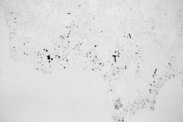 A ragged brick wall. Peeling putty, cement, paint. Unloaded wall, preparation for repair. Texture, cracked, chipped.