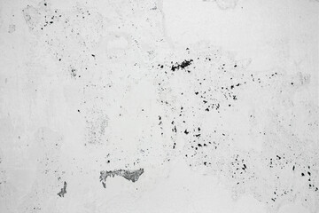 A ragged brick wall. Peeling putty, cement, paint. Unloaded wall, preparation for repair. Texture, cracked, chipped.