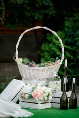 Fototapeta na wymiar Basket with flowers summer decoration