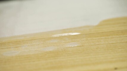 Man with a spatula spread the resin on CERF Horde