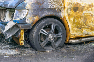 Fototapeta na wymiar Fragment of burnt car