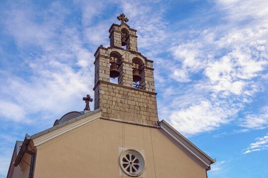 Religious architecture. Montenegro, Herceg Novi, Djenovici village. Bell tower of St. Spyridon Church against sky