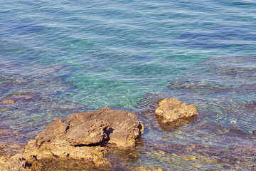 Rocky sea coast of Kolimvari in Crete Greece with turquoise water as a natural background. Copy...