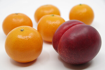 Nectarine and mandarins isolated on white background.