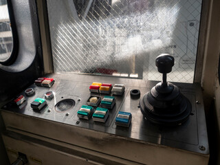 old vintage aerobridge controller and joystick. no person. warm light from sunset.