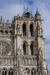 Fototapeta premium Architectural fragments of the central portal Amiens Gothic Cathedral (Basilique Cathedrale Notre-Dame d'Amiens, 1220 - 1288). Amiens, Somme, Picardie, France.