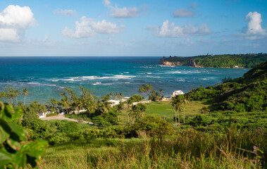 Fototapeta na wymiar Scenic view from a hill overlooking the idyllic tropical coastline of Barbados.