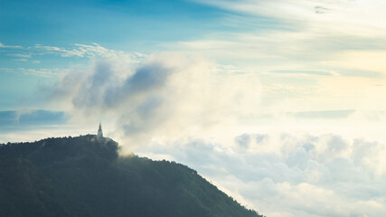 Landscape view at sunrise with puffy foggy. Foggy covered in the morning of Phu Thap Boek, Thailand.