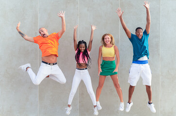 Happiness, freedom, motion, diversity and people concept. Multiracial group of happy smiling men...