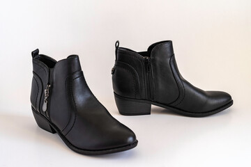 black female shoes on white background.