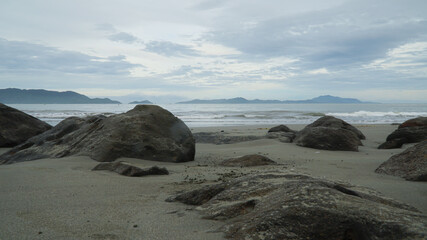 Fototapeta na wymiar The rocks on the beach
