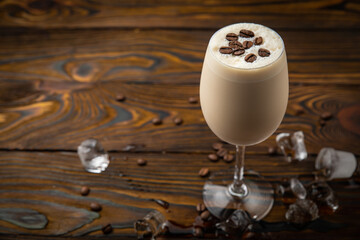 Coffee drink frappe. On a brown wooden table.
