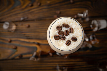 Coffee drink frappe. On a brown wooden table.
