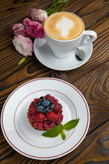 Fragrant French pastries, dessert. On a brown wooden table.
