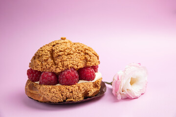 Fragrant French pastries, dessert. On the pink table.
