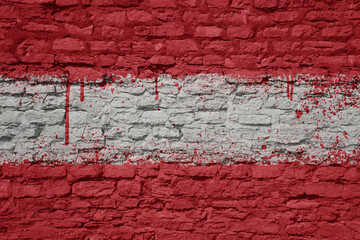 painted big national flag of austria on a massive old brick wall