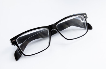 Glasses of black color on a white background close-up. Isolate