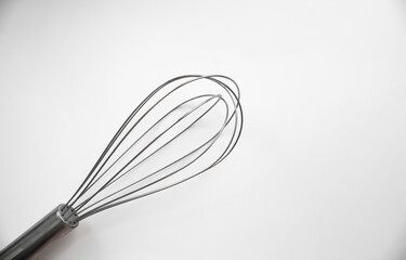 Gray whisk on a white background