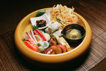 gourmet Japanese or asian omakase lunch set with raw fish sashimi, deep fried tempura, grilled steak, meat and vegetables