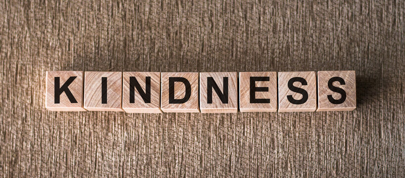 The word KINDNESS written in wooden blocks