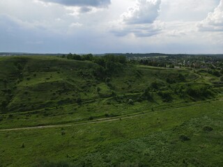 Aerial view of green hills on a cloudy day
