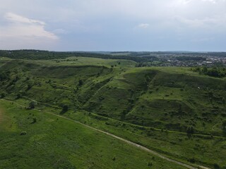 Fototapeta na wymiar Aerial view of green hills on a cloudy day