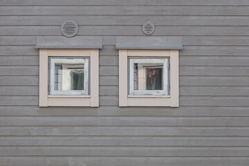 Background. Windows in a wooden house. Scandinavian architecture, old houses. Finland.