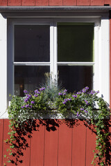 Background. Windows in a wooden house. Scandinavian architecture, old houses. Finland.