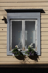 Fototapeta na wymiar Background. Windows in a wooden house. Scandinavian architecture, old houses. Finland.