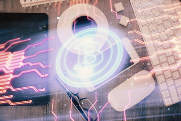 Double exposure of blockchain theme hologram over table with phone. Top view. Crypto technology...