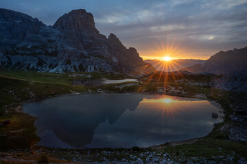 Sunrise on lake on tre cime di lavaredo Dolomites Italian alps - obrazy, fototapety, plakaty