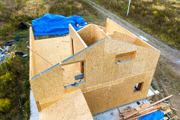 Construction of new and modern modular house. Walls made from composite wooden sip panels with...