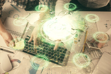 Double exposure of man and woman working together and social network theme hologram drawing. Computer background. connecting concept. Top View.