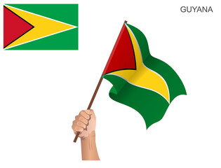 Flag of Guyana raised with a stick held by hand to inflame the spirit of statehood