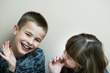 Two children boy and girl fooling around having fun together. Happy childhood concept.