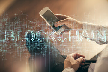 Double exposure of man's hands holding and using a phone and crypto currency blockchain theme drawing.