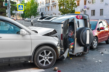 Car crash accident. Collision and damage in the city of three cars. Crossroads car accident. 