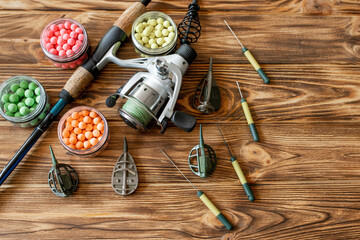 Accessories for carp fishing and fishing baits on wooden planks with copy space