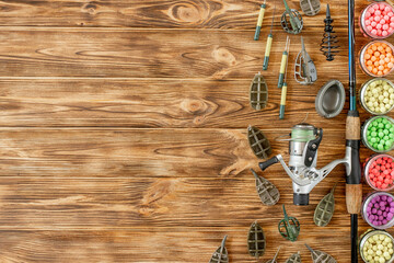Accessories for carp fishing and fishing baits on wooden planks with copy space