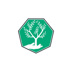 Tree in hand vector logo design. Natural products logo. Cosmetics icon. Spa logo.