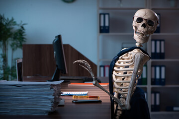 Young male employee working in the office night time