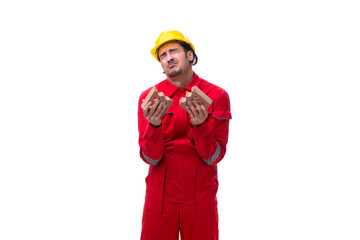 Young male mason with brick isolated on white
